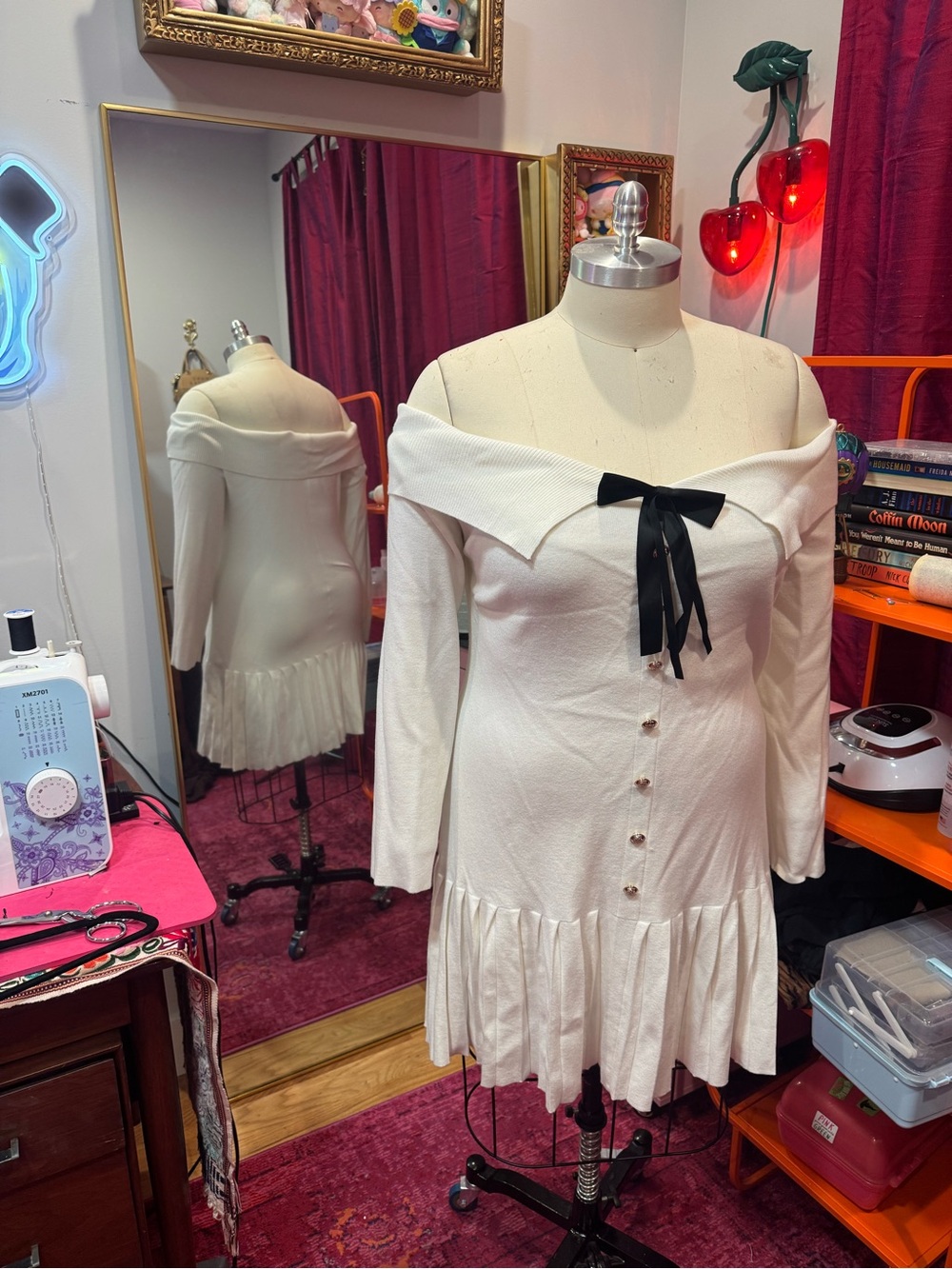 Cider Off-Shoulder White Long Sleeve Ruffle-Hem Dress with Black Bow